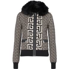 Wool Jackets Balmain Monogrammed knit jacket with faux fur black