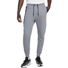 Nike Slim Trousers Nike Men's Sportswear Tech Fleece Sweatpants - Cool Grey/Metallic Gold